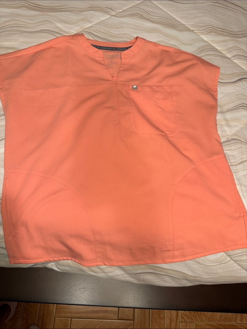 Women’s fabletics scrub top in Coral